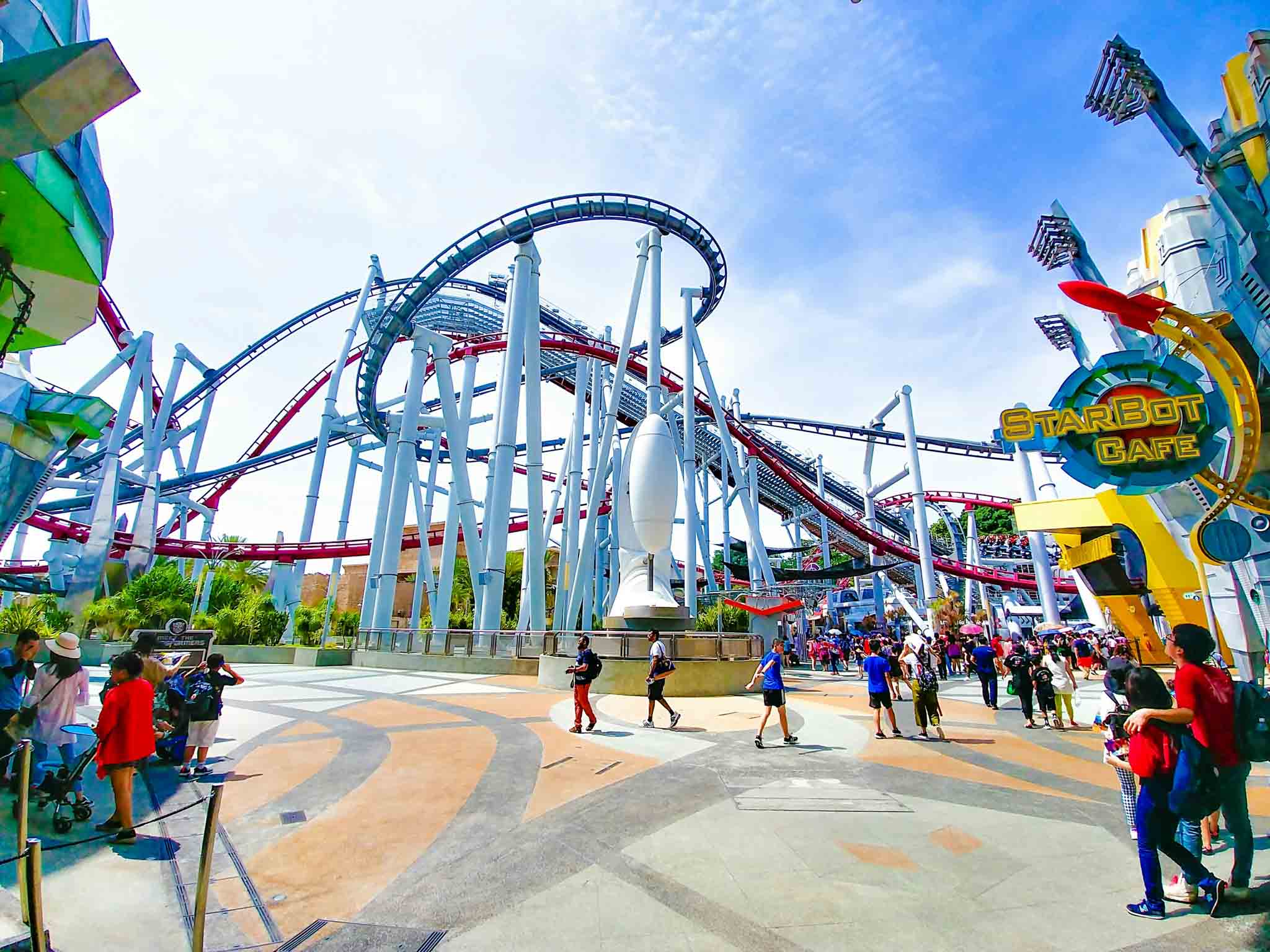 Theme park rollercoaster at golden hour — Disney and Universal vacation planning